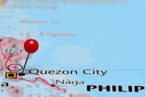 Map of the Philippines with Quezon City under magnifying glass.