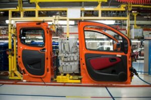 Vehicle doors on car assembly line.