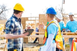 construction workers discussing project on site