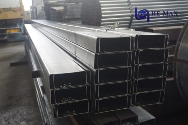 Rectangular hollow steel sections (RHS) stacked for structural steel fabrication, industrial buildings, and construction applications.