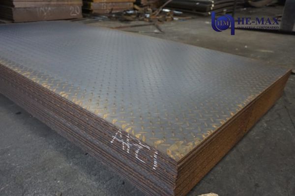 Stack of steel checkered plate sheets